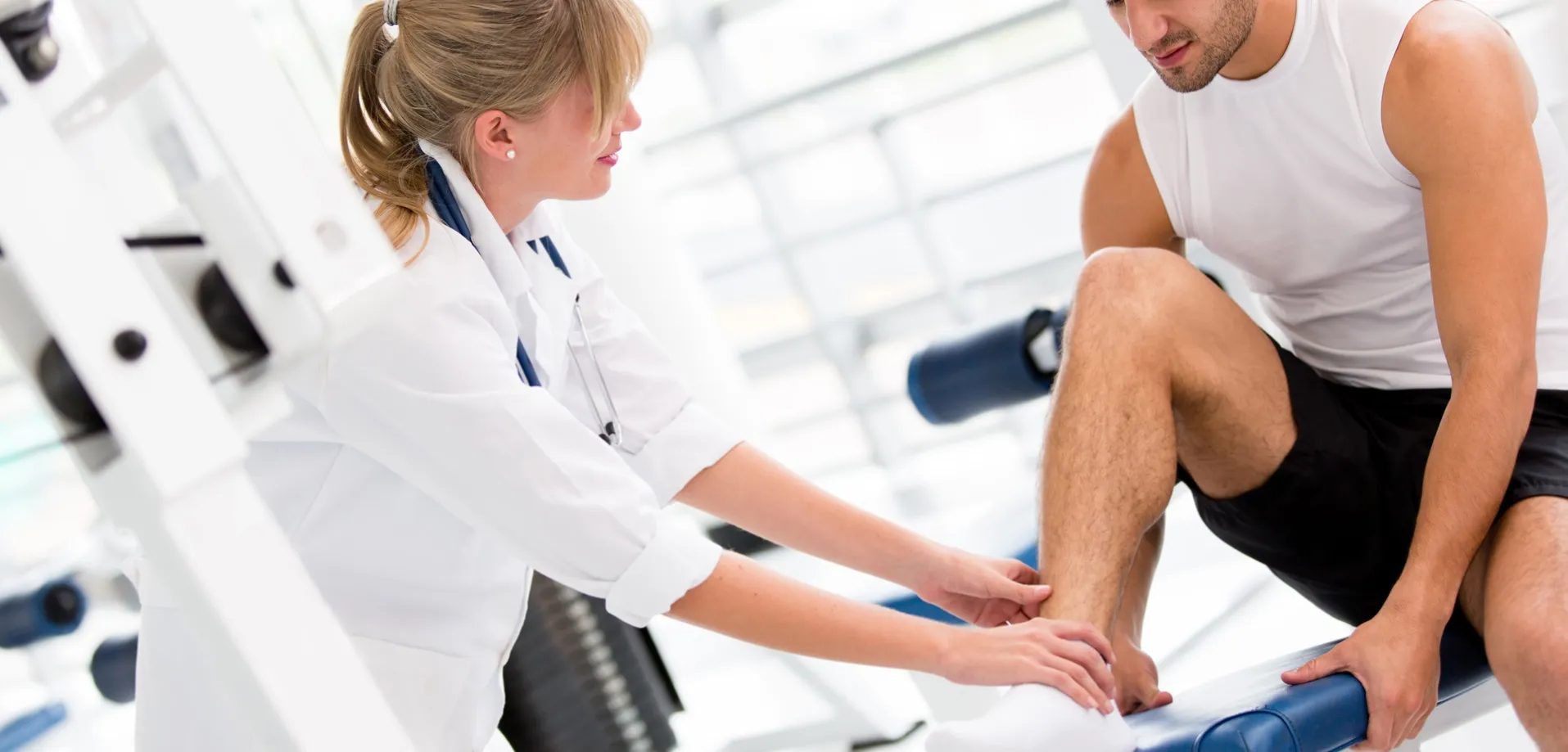 an athletes getting checkup by a physiotherapy 