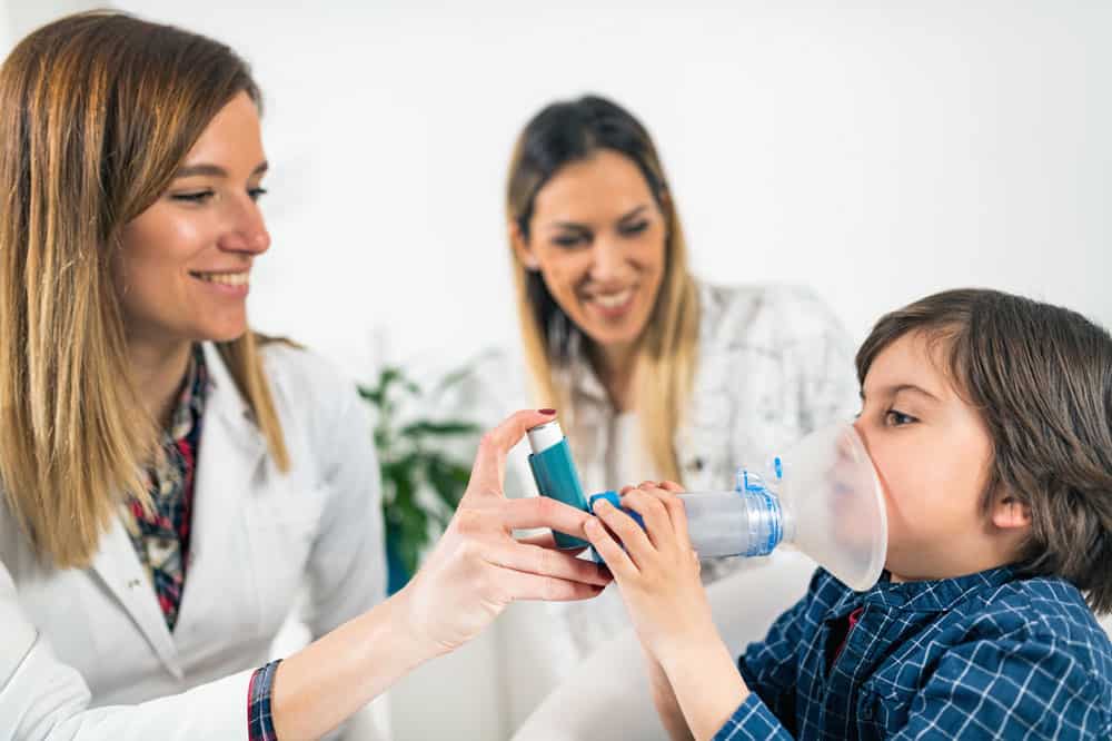 doctor-helping-boy-breath