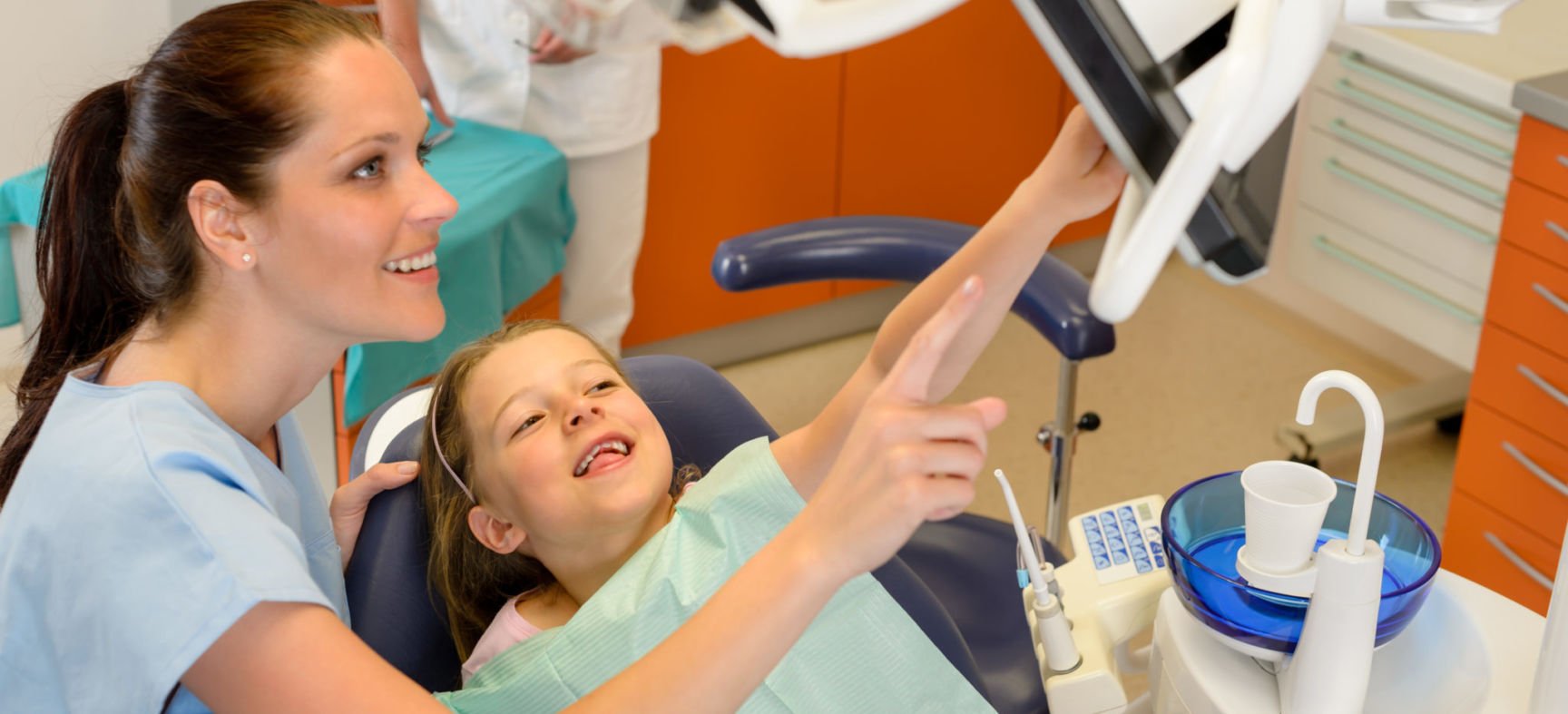 Pediatric Dentist with a child patient