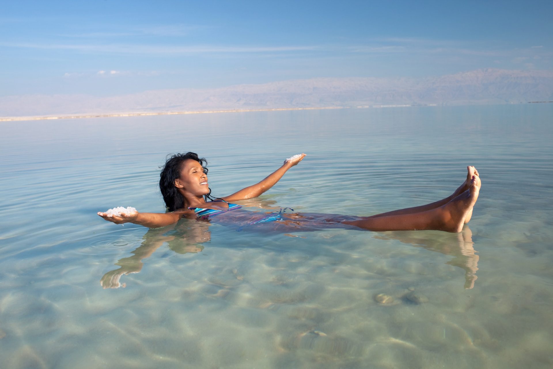 A women in the sea water enjoy